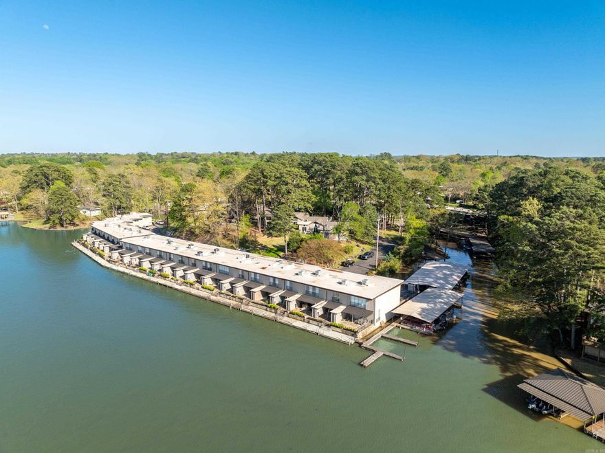 DONT MISS THIS ONE!  LAKE ACESS CONDO! NO SHORTTRM RENTALS! Moonlight Bay Condo is a gated community,  Meticoulously Maitained ,Boat dock avaiability, Single storty ( No stairs)   Covered Parking.  Stunning 2-bedroom  2-Bathroom - master suites. This condo provides privacy and comfort,  and a peaceful enviroment . Open floor plan, vaulted ceiling. Remodeled. Landscaped patio and separate private porch. Recent  upgrades include a new HVAC and new roof. Located near Lake Hamilton, minutes away from Historic Hot Springs and close to Oaklawn Racetrack and Casino. Don't miss out on this exceptional opportunity to own a piece of paradise!