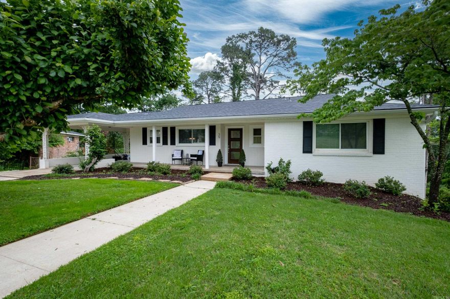 Incredibly charming, beautiful home on a quiet street in Kingwood!  The most precious front porch welcomes you.  Walk inside to a cozy great room with double glass French doors that open into a lovely office.  Living/dining open concept floor plan.  Updated kitchen with quartz countertops, built-in cabinets with glass doors, and a cute breakfast nook. Farmhouse sink, stainless steel appliances. New dishwasher, 2024. New refrigerator, 2020. Lots of natural light! Refinished hardwood floors and updated lighting throughout.  Generous primary bedroom with en-suite bath on the main level, along with a 2nd bedroom and hall bath.  All bathrooms have been beautifully updated!  Second cozy living area and a third bedroom, along with a 1/2 bath, down.  Separate laundry.  New roof, 2023.  New primary bedroom window, 2023.  New downstairs double glass doors, 2023.  New shutters, 2024.  New gutters, 2023.  Beautifully landscaped with excellent curb appeal.  Pretty carport, sprinkler system, and ask about a new deck.  All tucked away in convenient Kingwood. Perfection!  Come see before it's gone.  Agents, see remarks.  This home was partially impacted by the 2023 tornado.