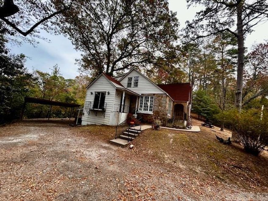 This cozy abode boasts a spacious fenced-in area, perfect for outdoor gatherings or simply enjoying the fresh air. With a convenient location just a short walk from downtown Hot Springs, you'll have easy access to all the shops, restaurants, and entertainment the area has to offer. Inside, you'll find a refrigerator provided and a washer and dryer for added convenience. With one acre of land, there is plenty of room to spread out and enjoy the peaceful surroundings. Don't miss out on the opportunity to make this lovely house your new home!