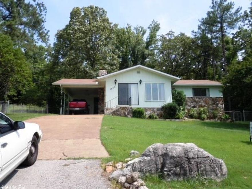 LAKE LOVER? Picture this: scenic lake view lot with lots of mature shade trees, like new 2 bd/2 ba ranch home in quiet, peaceful surroundings plus completely fenced 3rd lot available. Open floor plan, large breakfast bar island w/2 stools, 7x19 sunroom/office on front of house, 13x18 screened porch & 13x20 open deck on back of house. Fenced back & side yard, in ground sprinkler system, wood burning f/p w/insert in lr, walk-in closet in mstr bdrm w/built-in safe. Lot dim & rm dim are approx. & rounded down.