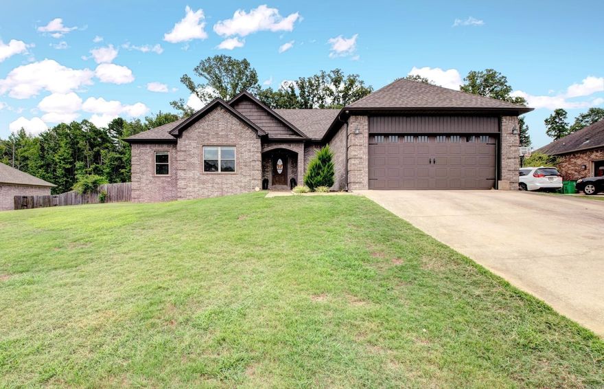 Discover comfort, space, and functionality at 131 Hudson Branch! Located at the back of a peaceful subdivision, this charming all-brick home offers privacy and timeless style. Step inside to find a spacious open-concept layout accented by warm hardwood floors, custom stained cabinetry, and a neutral color palette that suits any décor. The heart of the home—the eat-in kitchen—features ample counter space, a breakfast bar, pantry, and plenty of storage, making it perfect for everyday living and hosting guests alike. The generous primary suite offers a quiet escape, complete with a soaking tub, separate shower, private toilet area, and a large walk-in closet. Relax by the cozy fireplace or enjoy the outdoors in your oversized, privacy-fenced backyard with room for pets, play, and more. With sizable secondary bedrooms, a two-car garage, and placement in the highly rated Cabot School District, this home checks all the boxes! AGENTS PLEASE SEE REMARKS.