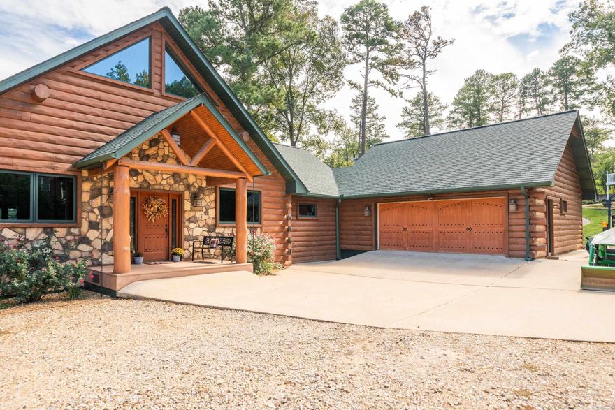 Welcome to this exquisite log home nestled on the shores of Lake Hamilton!  This stunning Property offers breathtaking views from every room.  The living area boasts soaring ceilings and large windows that frame the mesmerizing lake views.  There is potential for additional square footage in the unfinished basement area allowing you to customize and expand to suit your specific needs.  In summary, this log home on beautiful Lake Hamilton is a true gem, offering a harmonious blend of rustic charm, luxurious comfort and breathtaking views.  With the boathouse and the potential for additional footage, it presents an incredible opportunity to embrace lakeside living at its finest!