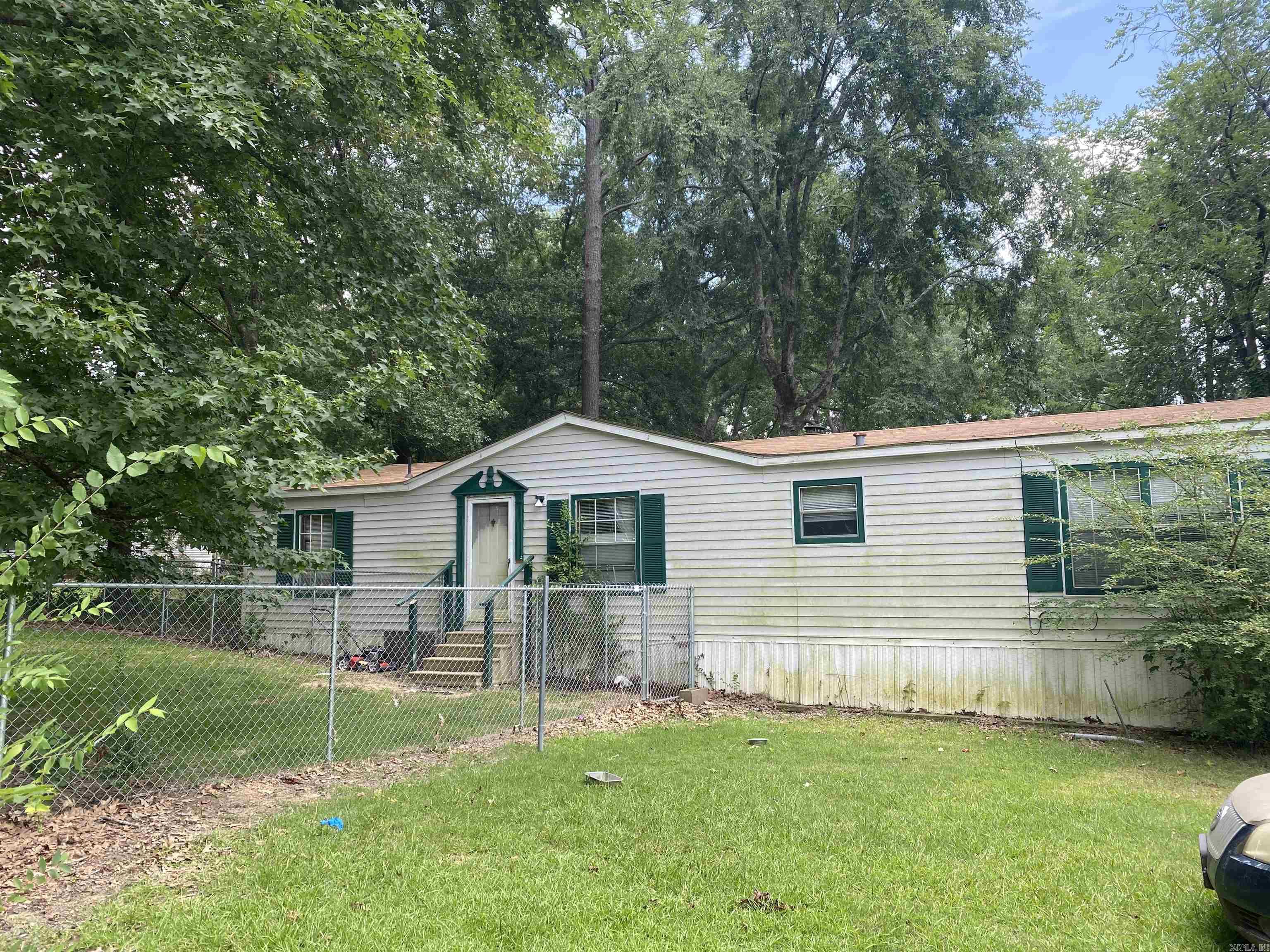 3 bed / 2 Bath 1995 Mobile home on 1.45 acres. Covered porch. Fenced in area. All electric. City utilities. Being sold as-is. Metal carport will convey. HWH 2023, Roof 2020, Central HVAC 2017