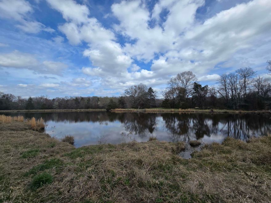 Premier 200± acres less than ½ mile from Conway city limits with exceptional access, utilities, and Lake Conway frontage. This tract offers approx. 4,500 ft of lake frontage, 2,500 ft on Caney Creek Rd (both sides), 1,900 ft on Skunk Hollow Rd, and 1,500 ft on Amity Rd (both sides). Flat corner at Amity and Caney Creek. Located approx. ½ mile from Conway Industrial Park and 1.5 miles from Lewis Landing and Lewis Ranch commercial areas. Land features open pasture, partially wooded areas, pond access, and diverse terrain suitable for grazing, recreation, or development. Electricity and water available along most roadways with multiple natural building sites ideal for rural subdivision. Property supports livestock, hunting, and mixed-use potential. Barbed-wire fencing in place. Buyers and agents should verify flood zones and development requirements. A rare large-acreage opportunity in a high-growth area of Central Arkansas.