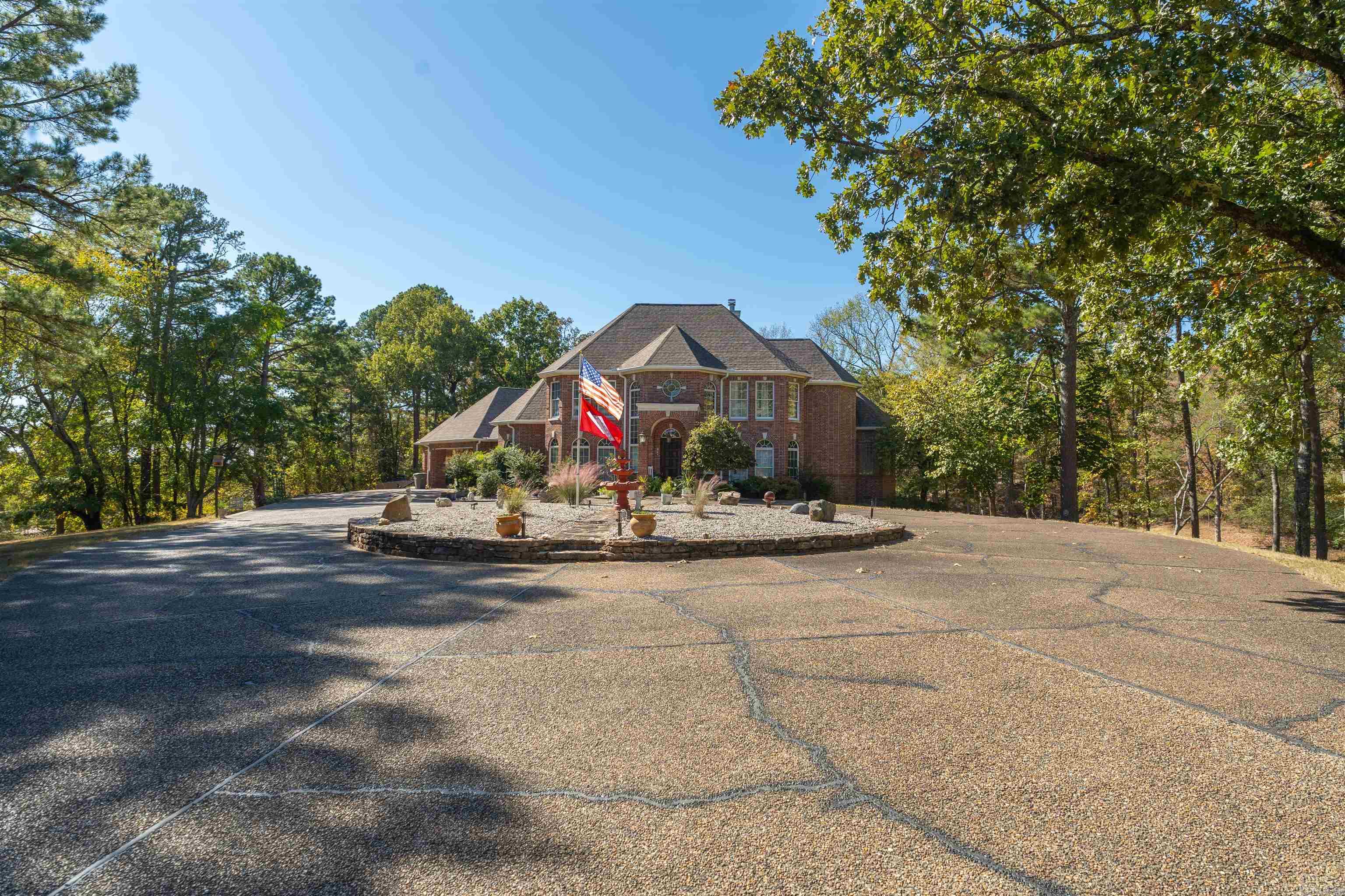 Discover the perfect blend of comfort and convenience at 113 Woodland Heights, set on 3.36 peaceful acres with a backyard pond and located just under a mile from Lakeside School. Inside, the 4-bedroom, 3.5-bath layout offers ample space for everyday living and entertaining. A welcoming foyer sets the tone, leading to an open floor plan with a gourmet kitchen, perfect for cooking and hosting guests. The primary suite on the main floor provides a private retreat with a spa-inspired bathroom. Upstairs, three additional bedrooms offer flexibility, with two connected by a Jack and Jill bathroom, ensuring convenience for family or visitors. Step outside to find a spacious deck equipped with an outdoor kitchen and a 7x15 spa—ideal for hosting friends or unwinding after a long day. The expansive property, with its pond and wooded surroundings, adds a peaceful, natural backdrop to the home. A 25x42 garage/workshop offers plenty of storage and space for projects, making this home as functional as it is beautiful. With its generous acreage, well-designed living spaces, and proximity to Lakeside School, 113 Woodland Heights offers a rare combination of privacy, style, and convenience.