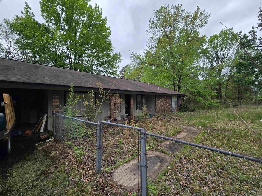 Solid brick home, ready to be renovated on 1.9 acres-zoned as 4 lots.  Being sold AS-IS.  Easy access from interstate 530. Quiet area.  Plenty of room to grow and expand.