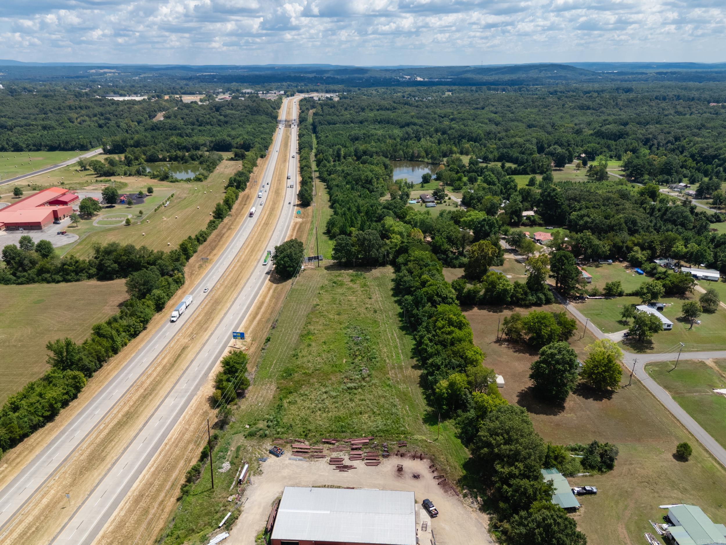 11 Acres Industrial Land with I-40 Frontage! Excellent opportunity with prime visibility along I-40. Zoned partly Industrial and Residential, this property offers high traffic exposure and easy access, ideal for commercial or industrial development. Rare find with endless potential for investors or businesses looking for expansion space.