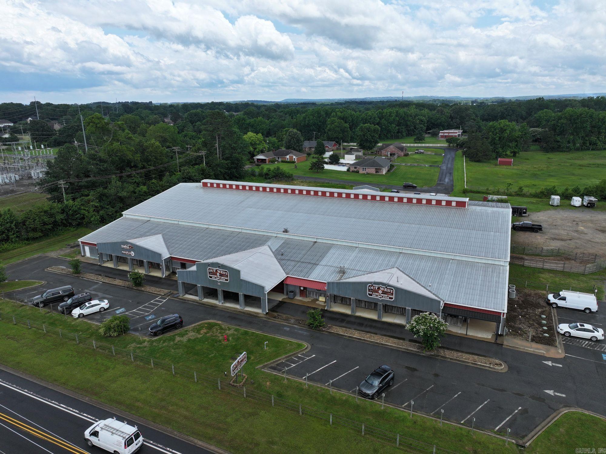 This ±50,500 SF facility in Conway, AR includes a ±30,920 SF covered horse arena and is currently leased to long-term tenants Out West Veterinary and Horseplay Hippotherapy, both well-established in the community. Out West Veterinary is the only clinic in Arkansas offering equine hydrotherapy, making the property a unique hub for advanced equine care. Strategically located along College Avenue with excellent visibility and access, the property is offered at a price well below replacement cost—an exceptional opportunity for investors or owner-users in a specialized, high-demand market.