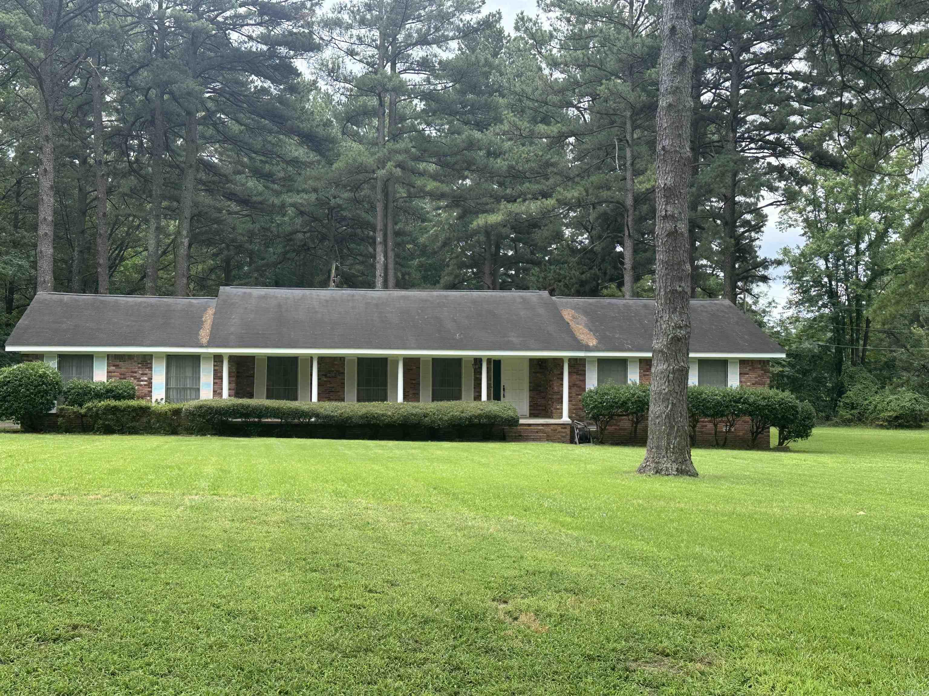 All brick one owner home on beautiful 2 acre corner lot in the city like new move-in ready seller has kept the house immaculate good size Good size living room In front of house nice den on the back with wood-burning fireplace open kitchen with like new cabinet breakfast bar and Eat in kitchen area lots of storage in the kitchen for the dining room on the front of the house joins living room hall bathroom has double sinks and vanity area. Master bedroom has nice stand-up shower with two closets home is moving in ready.