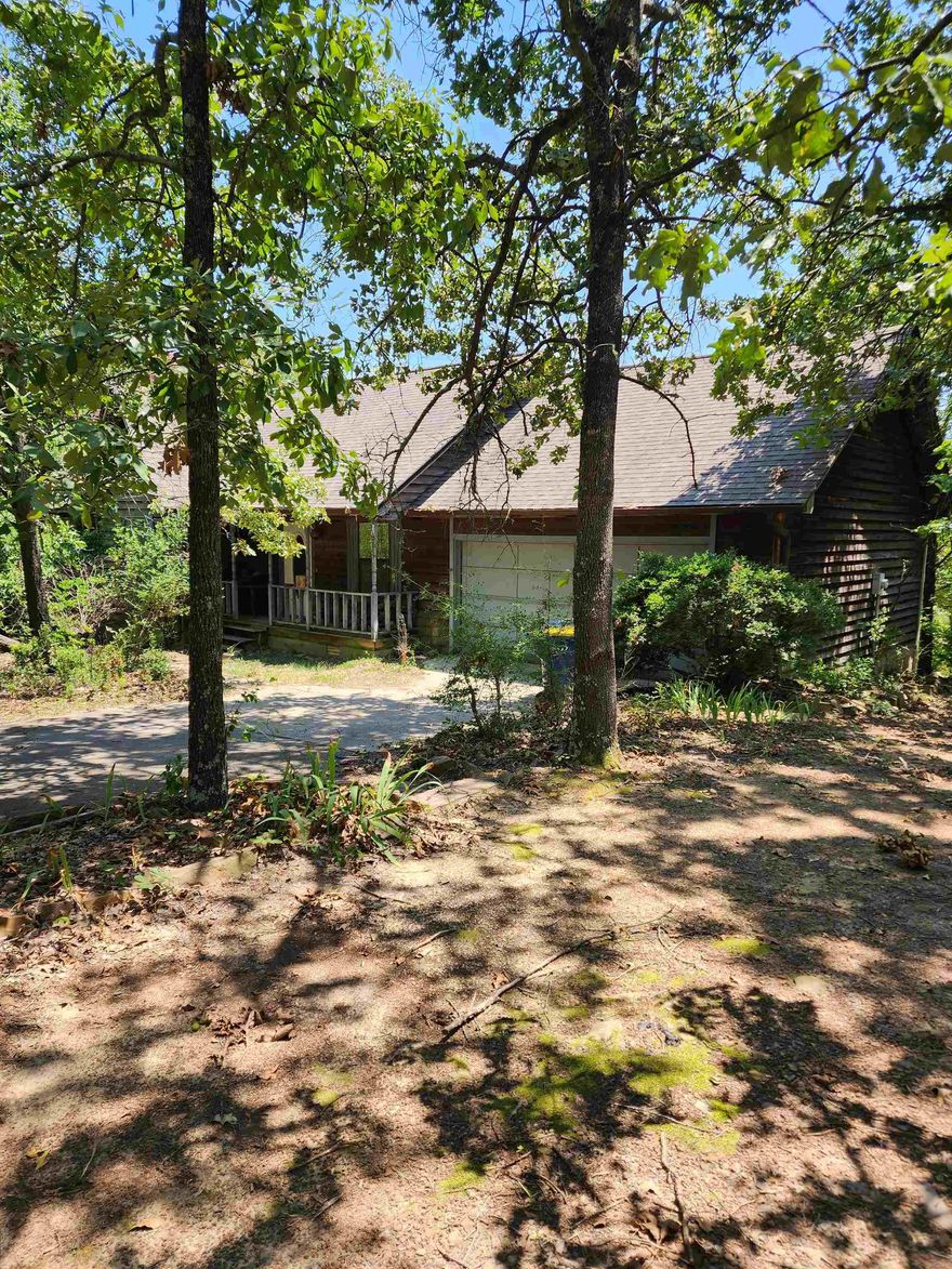 Come by and check out this house, you will feel like you are in a cabin in the middle of the woods. Large 3 bedrooms and 2 bathrooms, plenty of storage. Main bedroom has its private balcony to enjoy the natural view of your property. Woodburn fireplace for those cold nights. All the interior has been done, just need some love outside. Don't miss out on this one, come down and make it your own.  -Agents see remarks-