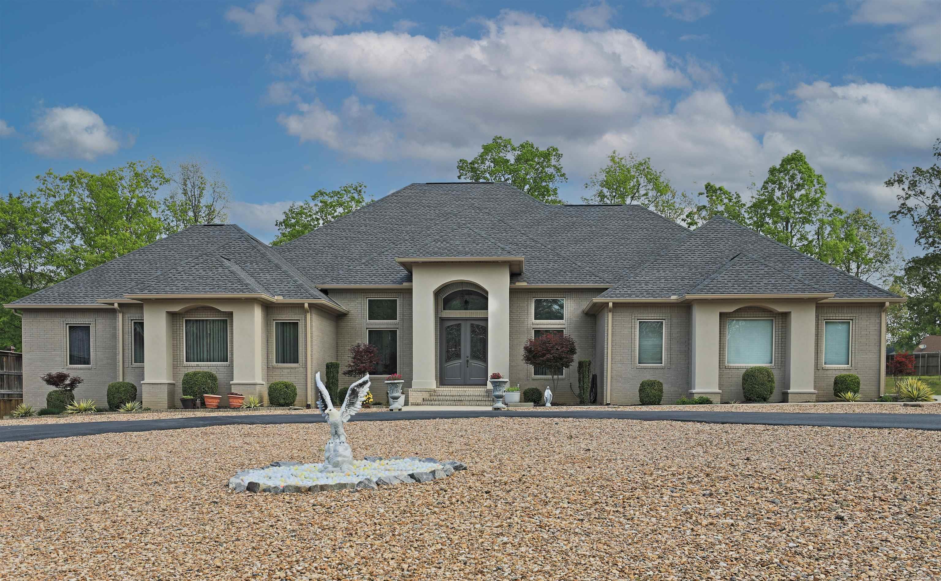 Breathtaking custom-built home featuring numerous upgrades! Step through the stunning double front doors into an inviting foyer that seamlessly connects to the dining rm, living rm & kitchen. Ceilings soar between 12ā-15ā! Gourmet kitchen has a COMMERCIAL fridge/freezer, 6 burner gas stove w/a pot filler, custom-built cabinets w/plenty of extras, & spacious walk-in pantry. The living rm, complete w/a gas log fireplace, features a tray ceiling w/recessed lighting & rises to 15ā! 3 bdrms w/ensuite baths & walk-in closets. Every bathroom (3 full & 2 half) has on-demand hot water! The office has a closet, & thereās a workout room w/a closet, & a large bonus room w/a walk-in closet; any of these spaces can serve as a bedroom. Enjoy the ultimate laundry room, safe room, & climate-controlled hunting room. 2 garages: 1 oversized w/dbl doors & a storage closet, & the other w/a workshop w/a sink; both garages are heated/cooled. Pool-ready, featuring a designated area for the pool pump & a room w/a half bath accessible from back porch. NEW HVAC unit w/5 temp zones, NEW roof, NEW engineered hardwoods, NEW carpeting in the bedrooms, NEW 6ā gutters, & much more!