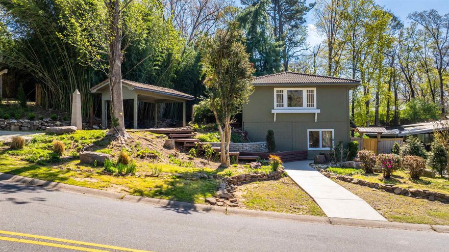 This is a fully updated, thoughtfully designed 3 bed 3 bath with a one-of-a kind backyard oasis, in the heart of Midtown Little Rock.  Inside, you’ll find all new flooring, fresh paint, and a clean, contemporary feel throughout. The updated floor plan creates a seamless connection between the living, dining, and kitchen spaces—ideal for both everyday living and entertaining.  The kitchen has been beautifully refreshed with modern finishes, ample cabinetry, and a large island that naturally becomes the heart of the home.  The living spaces feel open and inviting, with natural light pouring in from multiple directions… and modern touches throughout that make it feel move-in ready from day one.    You’ll also find three generously sized bedrooms, each with spacious closets, giving you the room you actually need to spread out, stay organized, and truly feel at home.  Outside, you’re immediately welcomed by a multi-level deck system that guides you throughout. Water features create a calm, peaceful atmosphere, while the large pond becomes a true centerpiece.  With multiple areas to relax or entertain, this space flows seamlessly into a private, tree-lined setting that feels tucked away.