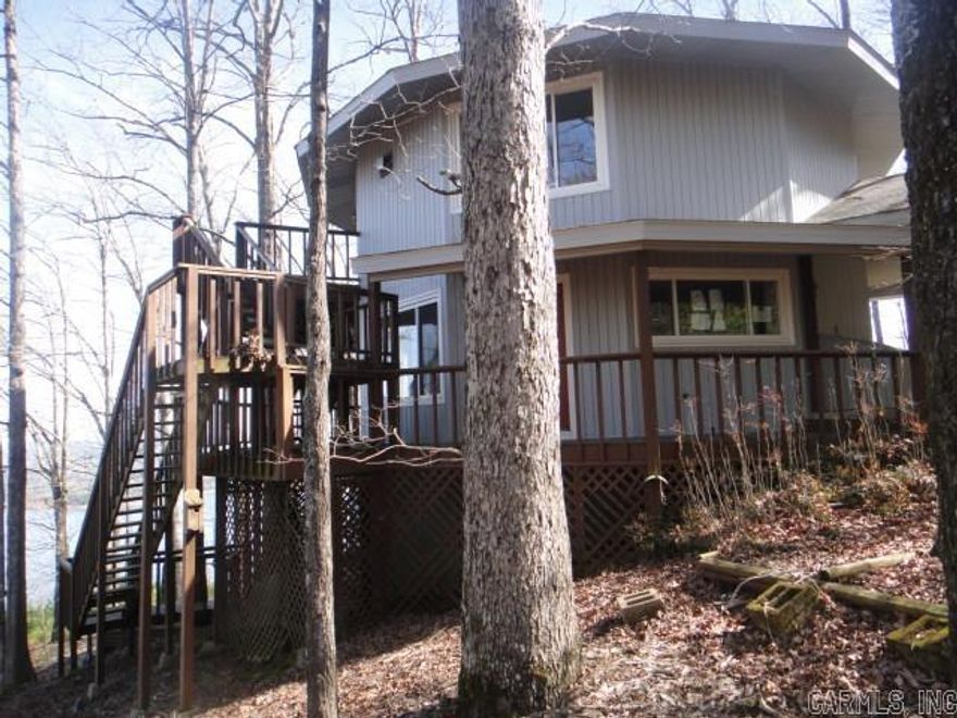 Check out the view of beautiful Greers Ferry Lake from the 3 level decks of this Contemporary home that sits on 1.66 acres. The lower level of this 3 story has a walk-out basement with a storage area attached to lower level. So much potential. This home can be 4 BRs or 3 BRs and Game Rm. Master BR is on 2nd level with almost panaramic view. Looking for a Summer home, retirement home or permanent home? Check this one out!! Please see Agent Remarks.