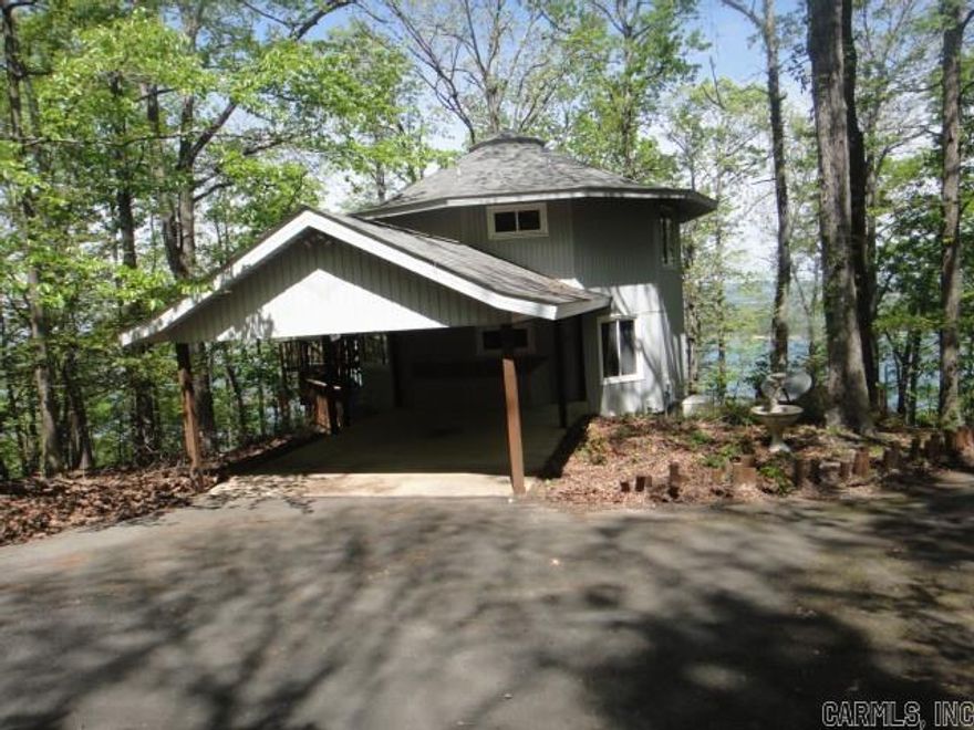 Check out the view of beautiful Greers Ferry Lake from the 3 level decks of this Contemporary home that sits on 1.66 acres. The lower level of this 3 story has a walk-out basement with a storage area attached to lower level. So much potential. This home can be 4 BRs or 3 BRs and Game Rm. Master BR is on 2nd level with almost panaramic view. Looking for a Summer home, retirement home or permanent home? Check this one out!! Please see Agent Remarks.