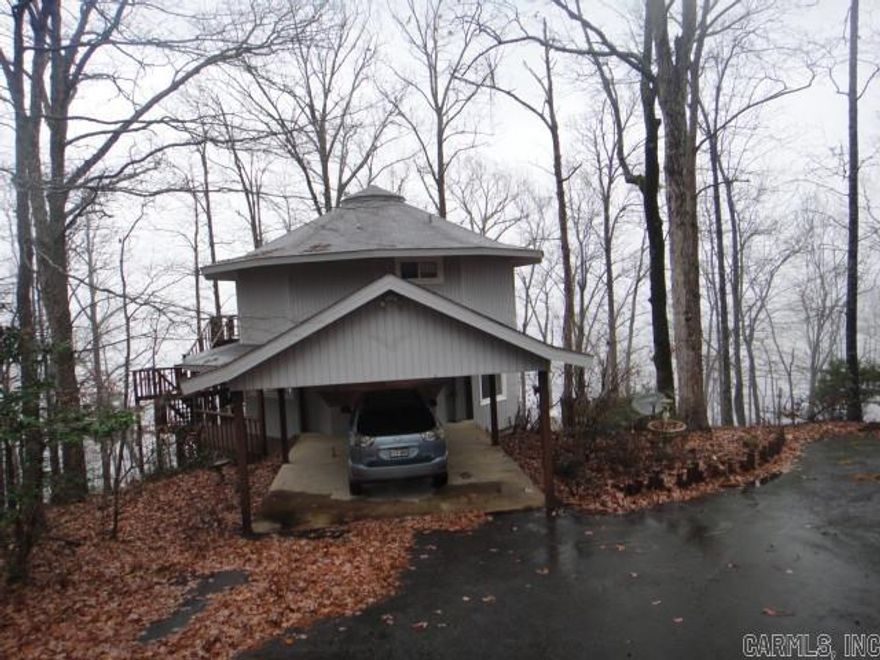 Stellar view of beautiful Greers Ferry Lake!! This cute Contemporary house sits on 1.66 acres with stunning views of the lake on all three deck levels. 3 story with lower level being a walk-out basement. Small storage area attached to lower level. Can be 4 BRs or 3 BRs and Game Rm. Master BR is on 2nd level with almost panaramic view. Looking for a Summer home, retirement home or permanent home? Check this one out!! Please see Agent Remarks.