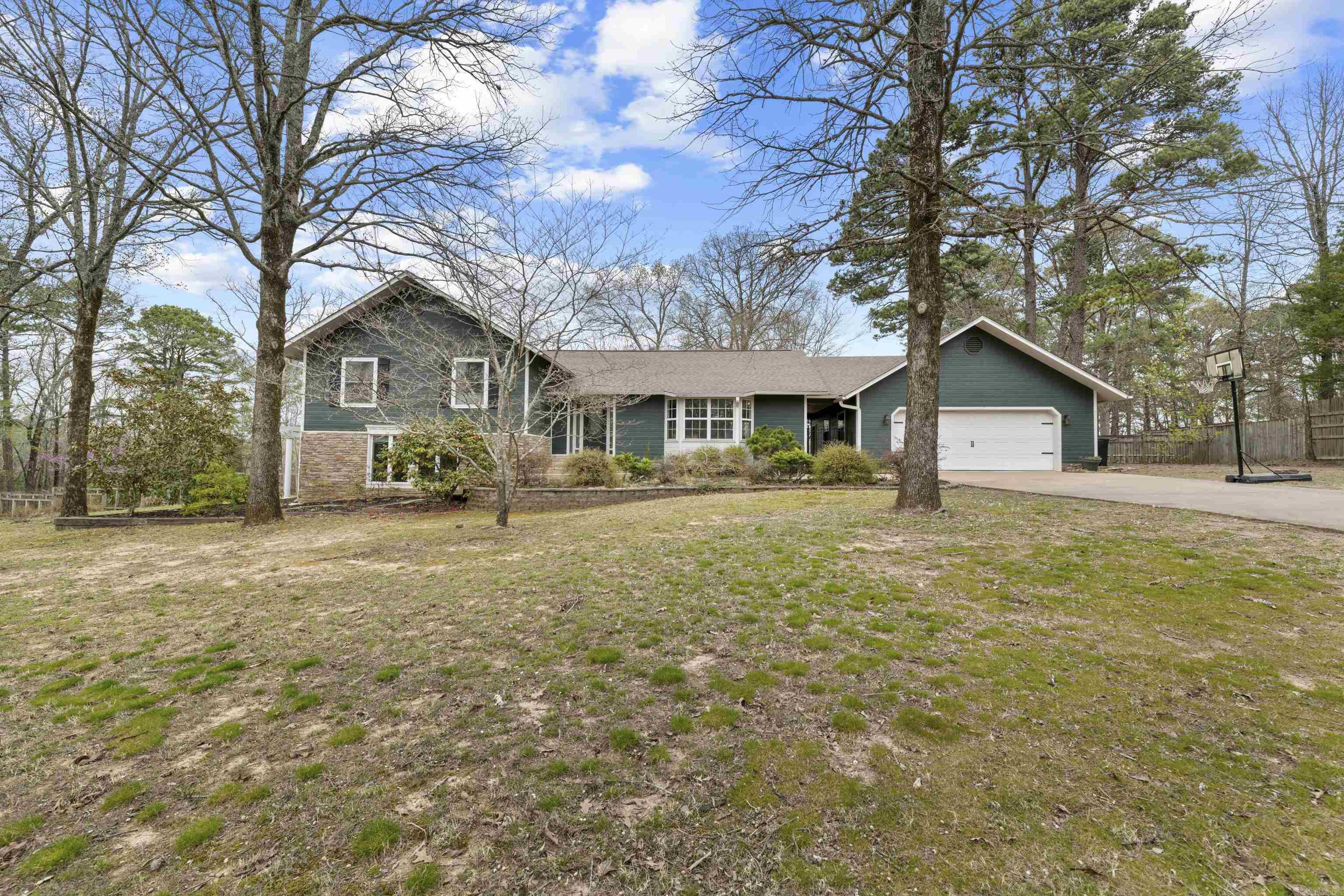 PRICE CHANGE and ready to sell! Beautiful family home located on a large corner lot in the heart of Heber Springs, just a short distance from the stunning Greers Ferry Lake. This charming home has been thoughtfully updated, offering a perfect combination of modern style & comfort for everyday living. As you step inside, you'll be greeted by open spaces featuring a gorgeous kitchen with top of the line new appliances & wood ceilings. The bright and airy living spaces are perfect for entertaining, while the generous-sized bedrooms provide a cozy retreat for the whole family. The master suite opens up to a private deck overlooking the pool as well as a newly remodeled master bath not to mention a brand new roof! Outside, the expansive corner lot gives you plenty of space to enjoy, including a sparkling swimming pool that's ideal for relaxing or hosting guests during the warmer months. Whether you're enjoying the pool or the large yard, this home is made for outdoor living. With its prime location just minutes from Greers Ferry Lake and the convenience of local amenities, this move-in-ready home is the perfect place to settle in & enjoy all that Heber Springs has to offer.