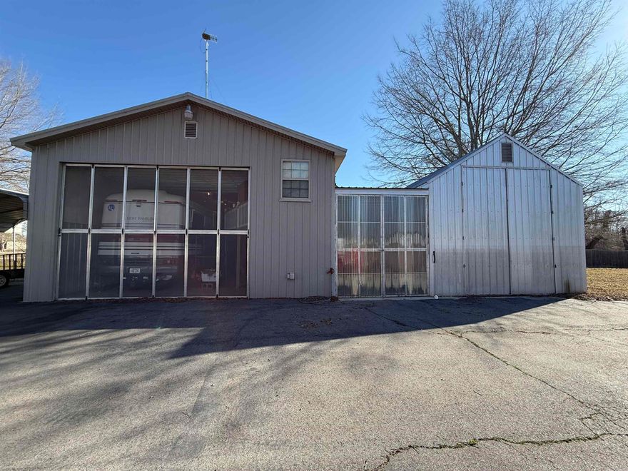 Wildlife enthusiast’s dream retreat! Perfectly set up for fishing and hunting adventures, this riverfront property offers the ultimate outdoor lifestyle. Sitting directly on the water, it features its own private boat dock and live well, making it ideal for anglers.  The 27’x44’ heated and cooled living space includes thoughtfully designed second floor living quarters with a custom built floor plan and beautifully crafted cabinets. An elevator provides easy access to hoist gear and supplies to the upper level.  The ground floor includes RV storage with full hook-ups and a roll-up door fitted with a screen so you can enjoy the breeze. A spacious 10’x44’ breezeway connects to an 18’x44’ shop/storage area, perfect for boats, ATVs, and equipment.  Located just 0.3 miles from Pendleton Access, with multiple other access points nearby, you’ll enjoy convenient entry to the water and surrounding recreation areas. Whether you’re seeking a weekend getaway or fully equipped base camp, this property is ready for adventure. Agent see remarks.