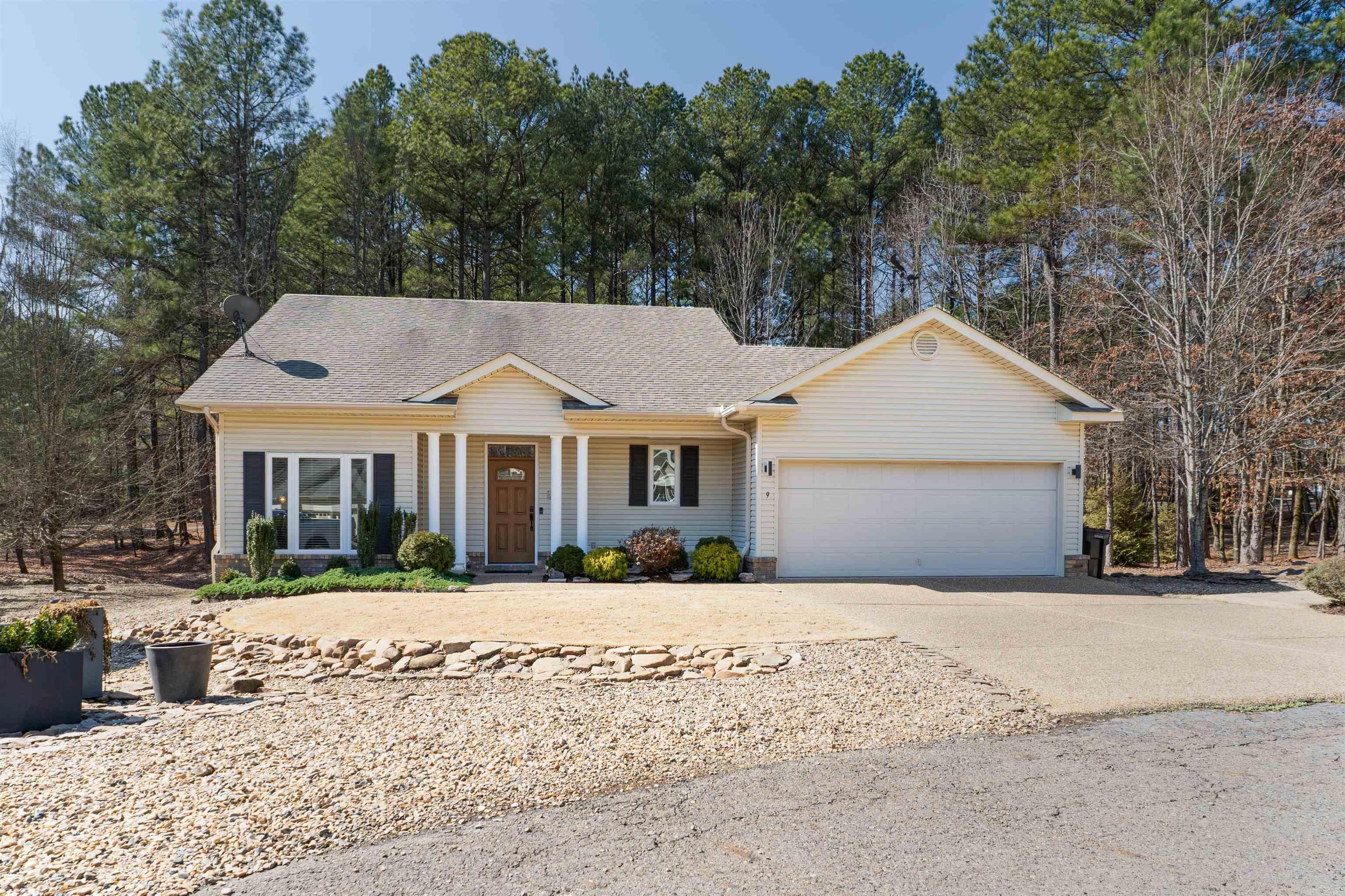 Desirable Maderas Gardens cul-de-sac home with a two car garage! Fabulous natural light through the expansive wall of windows that have been replaced with Simonton Energy Star casement windows, 50 gallon water Heater 2020, and Carrier HVAC 2023. Freshly painted interior and solid maple cabinetry throughout with hickory engineered hardwood flooring. Floor plan includes a spacious living-dining combo and kitchen with spacious counter top space! Two split bedrooms and two bathrooms creates a generous living arrangement! The patio allows for additional outdoor living space and overlooks the Diamante pickle ball courts through the woods! Maderas Gardens $185/monthly fee covers landscaped lawns with sprinkler systems, community building for entertaining, grills, social activities! Easy living in this desirable East end location. Hot Springs Village offers restaurants, medical, shopping, 9 golf courses, 11 lakes for boating/fishing, 30 miles of walking trails, tennis, pickle ball, playgrounds, and more. Whether you’re looking for relaxation, recreation, or both – it’s all right here. Permanent residents may qualify for the $500 Homestead Exemption!