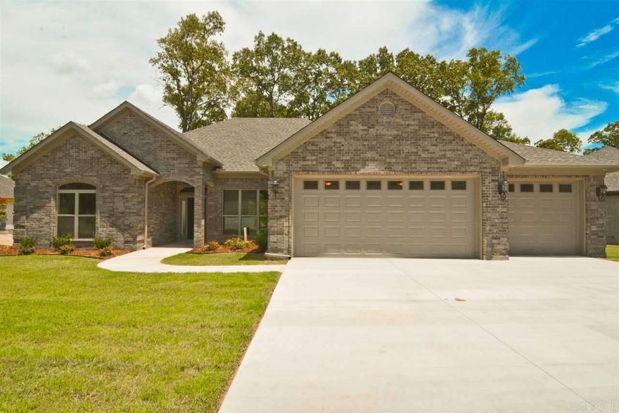 The one for you!!! This 4br.'s , 2ba.'s home has it all. Large great room with hand scraped hardwoods floors- Custom kitchen features granite counters, designer backsplash ,  & SS appliances- Laundry room w/ built-in desk flows through to master closet- Master bath boasts large tiled shower, jetted tub & a double sinks- Large covered deck- & finally a 3 car garage w/ walk-up attic. Builder has put a lot of extra touches into this beautiful home. This is a must see!