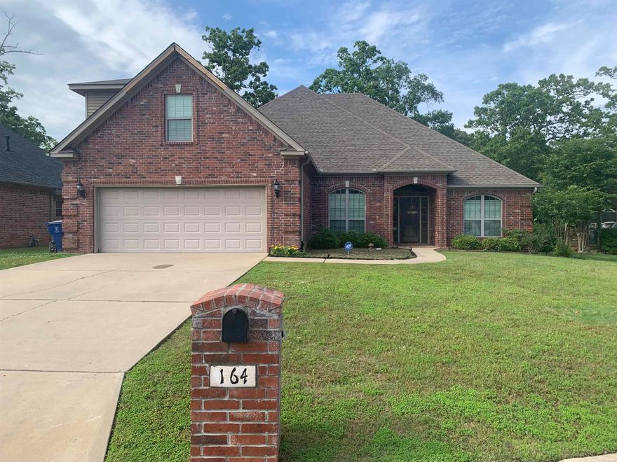 Home features 4 bedrooms, 2.5 baths, 2 car garage, fireplace, bonus room, patio kitchen, hot tub and is located only a 100 yards from the 17th green.