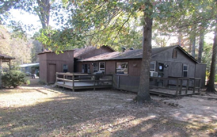 This 3 bedroom, 2 bath home sits on corner lot, outside of city limits, with front of home facing Hwy 270.  2 car garage, storage building, gazebo.   Large master bedroom.  Refrigerator remains.  **Agents See Remarks** Flood Zone Designation x.  This property may qualify for Seller Financing (Vendee).