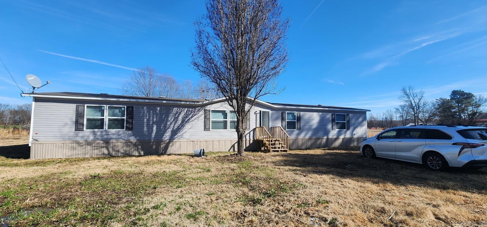 Well maintained 5 bedroom, 3 bath doublewide on 1+/- acre.