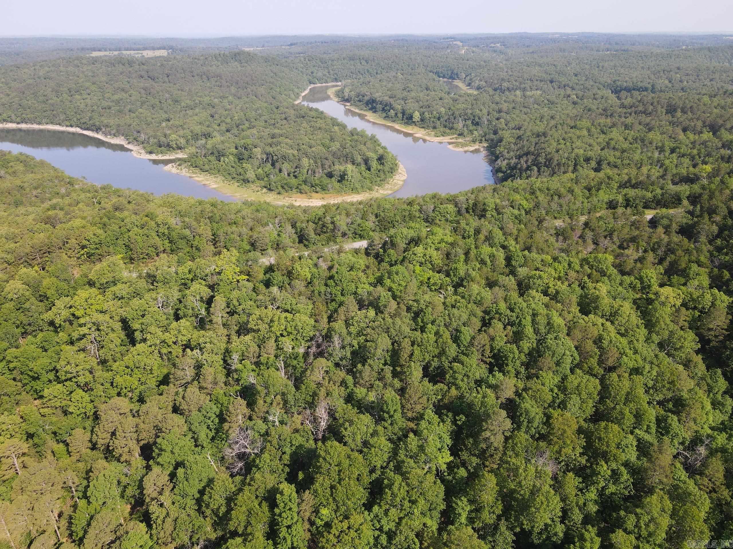 This fantastic multi-use recreational tract is loaded with features and a special location. Situated just outside the rural and quaint community of Elizabeth, AR sets a raw, unique, and truly stunning tract of Ozark timberland with ample opportunities. The property is fronted on three different locations by county roads, one being recently paved. This excellent access offers numerous options for developers looking for a project near the lake. And speaking of the lake⦠the property borders the Corp of Engineers Norfork Lake on two separate points. Public access to the lake is just about ½ mile down the road. This incredible lake spreads across three counties in MO and AR and is renowned for its fishing and recreation opportunities. With this awesome piece, endless marinas, campgrounds, fisheries, and parks are all right at your fingertips. Accessing the land with multiple points also gives you a chance to subdivide if desired and create whatever your heart desires. As you make your way through the healthy stand of timber, you will find a quality stand of White Oak, Red Oak, Hickory, and more⦠along with some thickets of cedar and even some younger pine.