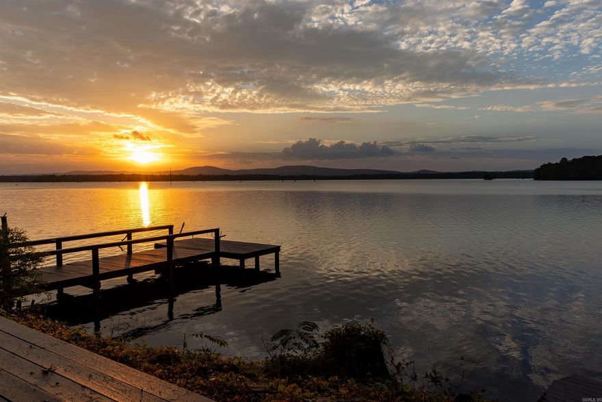 This charming lakefront home has everything you could desire in a lake house - boasting a massive lake view of Harris Brake Lake! Venture on out to the freshly stained back deck, where you can walk down to the covered boat slip to launch your boat for a morning full of fishing or enjoy the separate boat dock to cast for bream or sunbathe! This home features 2 bedrooms, 2 bathroom, an office and sunroom! The owner had the garage enclosed for a wonderful guest quarters or 3rd bedroom. It is heated and cooled with TONS of storage and a spot for a refrigerator or freezer! There is also covered RV parking, with access to water, electrical and septic hookup. Enjoy cooking dinner while watching the sunset, with the huge windows on the back of the home. Harris Brake Lake is the 3rd largest lake owned by the Arkansas Game and Fish Commission. Enjoy everything lake front living has to offer, while being close to the Ouachita National Forest! Centrally located between Conway, Little Rock and Russellville. Fiber internet is available here!