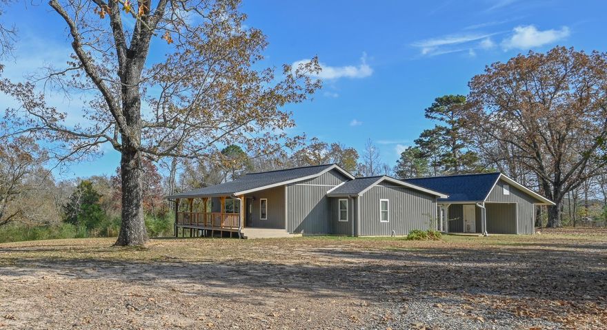 Welcome to Three Oaks, a peaceful and beautifully updated retreat nestled on approximately 5.15 scenic acres in town. This gorgeous 2-bedroom, 2-bath home is currently operating as a successful, established Airbnb and is being sold fully furnished—making it truly move-in or rent-ready from day one. The home features a modern, fully updated interior with comfortable, inviting spaces designed for relaxation. Enjoy the welcoming front porch—perfect for morning coffee or unwinding in the evenings while taking in the natural surroundings. Wildlife, including deer, are frequent visitors, adding to the peaceful country setting. Whether you’re looking for a personal getaway, full-time residence, or income-producing investment property, this one checks all the boxes. Plenty of room to expand, add amenities, or simply enjoy the privacy and peaceful setting. Located just minutes from Mena’s outdoor attractions, including ATV trails, mountain biking, and the Ouachita National Forest, this property offers the perfect blend of convenience and escape.