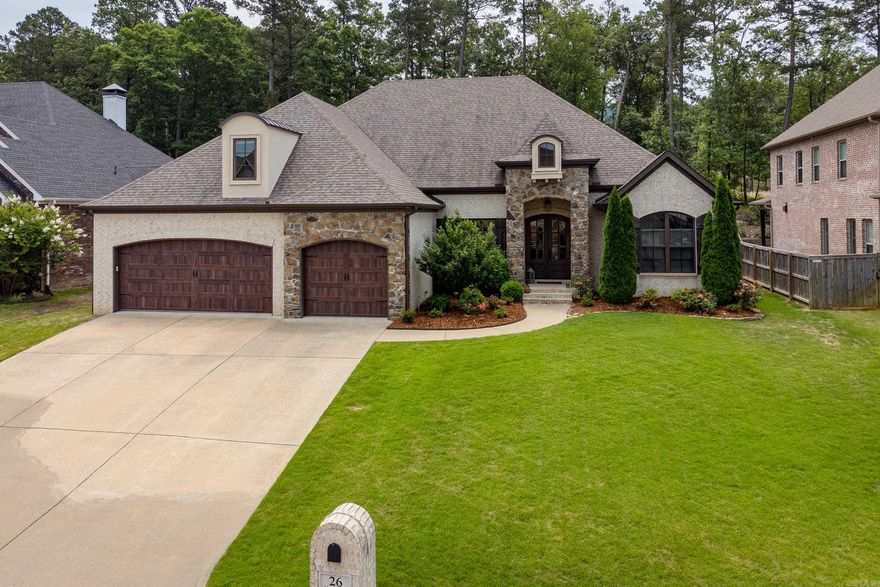 Beautiful home showcases open concept living. Tall ceilings with crown molding, gorgeous stone fireplace & HDWD floors thru-out. Large windows across the back looks out on the covered porch with WBFP and fenced yard backing to trees. Wonderful split floor plan has spacious Primary suite with spa bath and large closet. Guest bedroom/office with bath off living area and two guest bedrooms with shared bath off kitchen. Fabulous eat-in kitchen with gas range, wall ovens and center island. Built-ins, laundry room & pantry closet. Up has large Bonus/5th bedroom & full bath. Granite tops thru-out. 3 car garage. Come See!