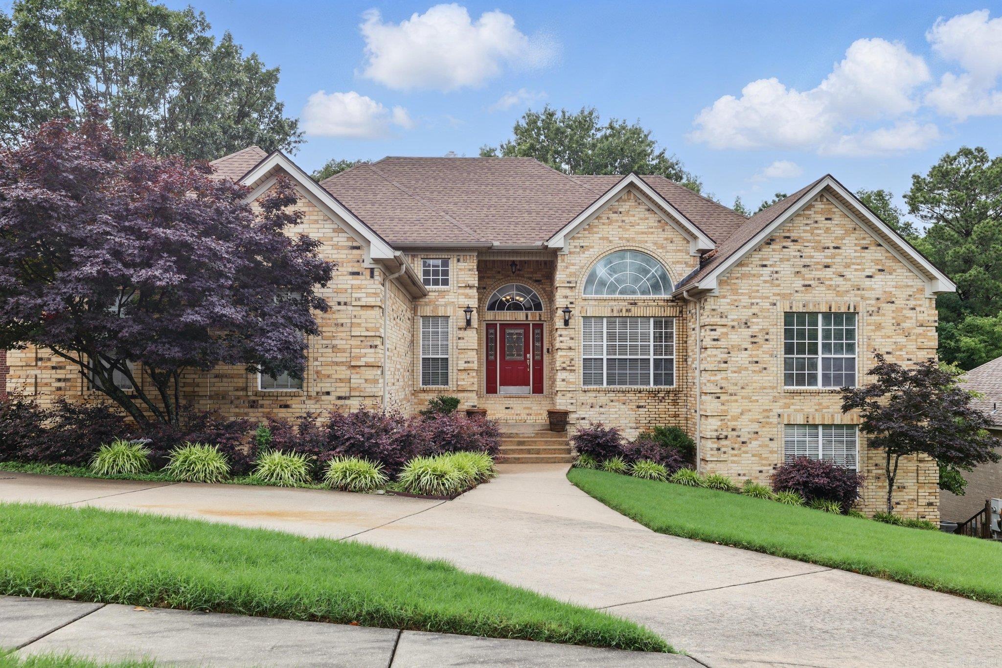 Welcome home to this spacious and beautifully designed 4-bedroom, 4-bath home tucked away on a quiet cove in North Little Rock. With over 3,200 sq. ft. of living space, this property is perfect for multigenerational living or anyone looking for room to spread out and enjoy! The main-level primary suite is generously sized and features a luxurious ensuite bath complete with a standalone shower, whirlpool tub, and plenty of space to unwind. An office space for working from home. The kitchen is a chef’s dream, showcasing granite countertops, stainless steel appliances, and ample prep space for everything from weeknight dinners to Iron Chef-worthy meals. Granite continues throughout the home, adding a touch of elegance to every space. Downstairs, the fully finished lower level offers even more flexibility—complete with a living area, bedroom, full bathroom, and a wet bar with a mini-fridge. Whether it’s a private space for in-laws or a teen looking for independence (wink wink), this setup is a major win. Step outside and you’ll find a tiered deck—ideal for entertaining, cookouts, or just enjoying the beauty of the Arkansas weather with a morning coffee or evening glass of wine.