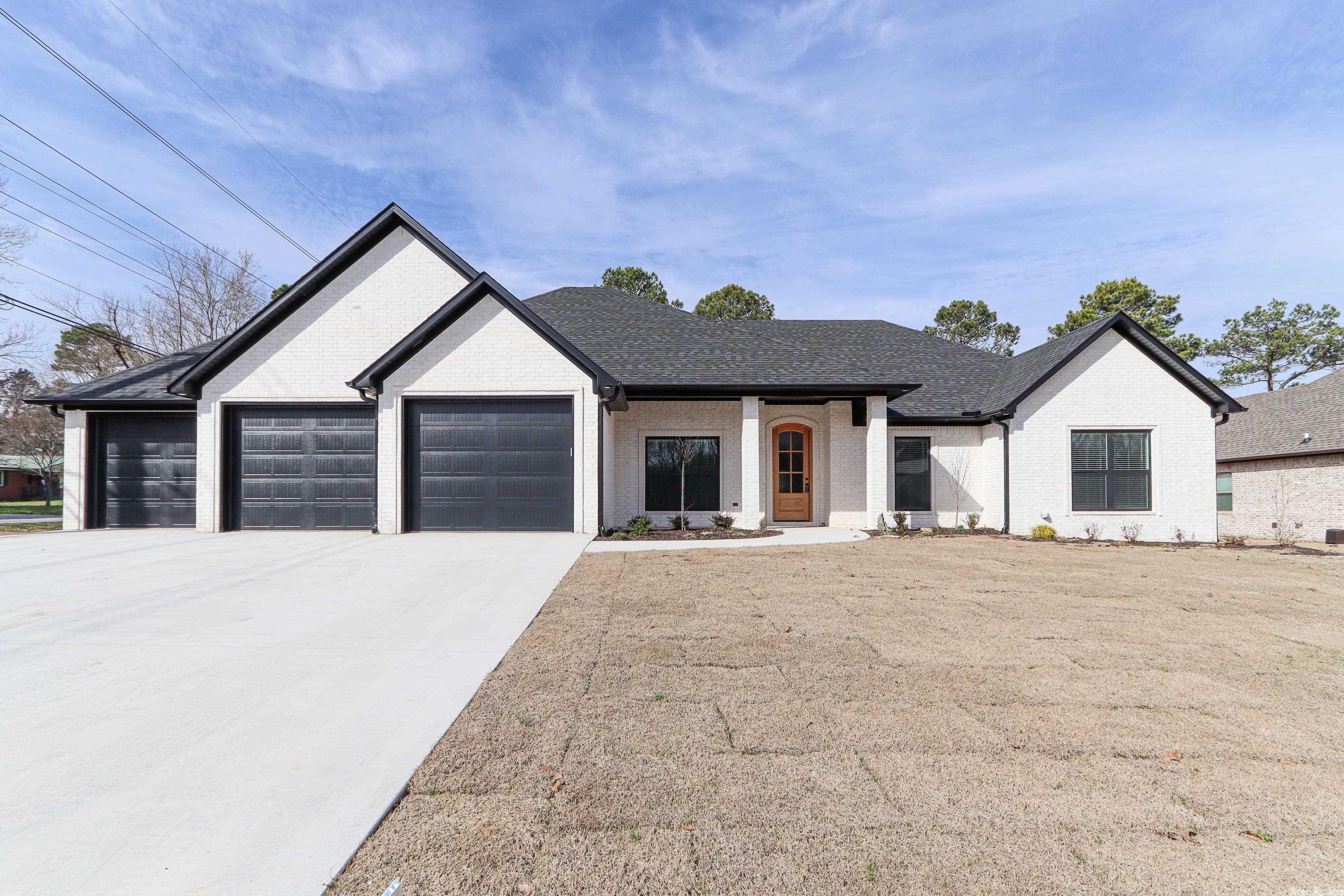 This Modern Ranch 5 bedroom home has everything you may be looking for and more, the inviting entry and open floor plan exudes luxury and comfort, the expansive screened in porch adds additional space for entertaining, the split bedroom plan gives privacy for the primary suite location and a three bay garage is avail for extra storage. All white Kitchen cabinetry with an Island bar for seating and dining area, granite counter tops throughout and luxury plank vinyl flooring.