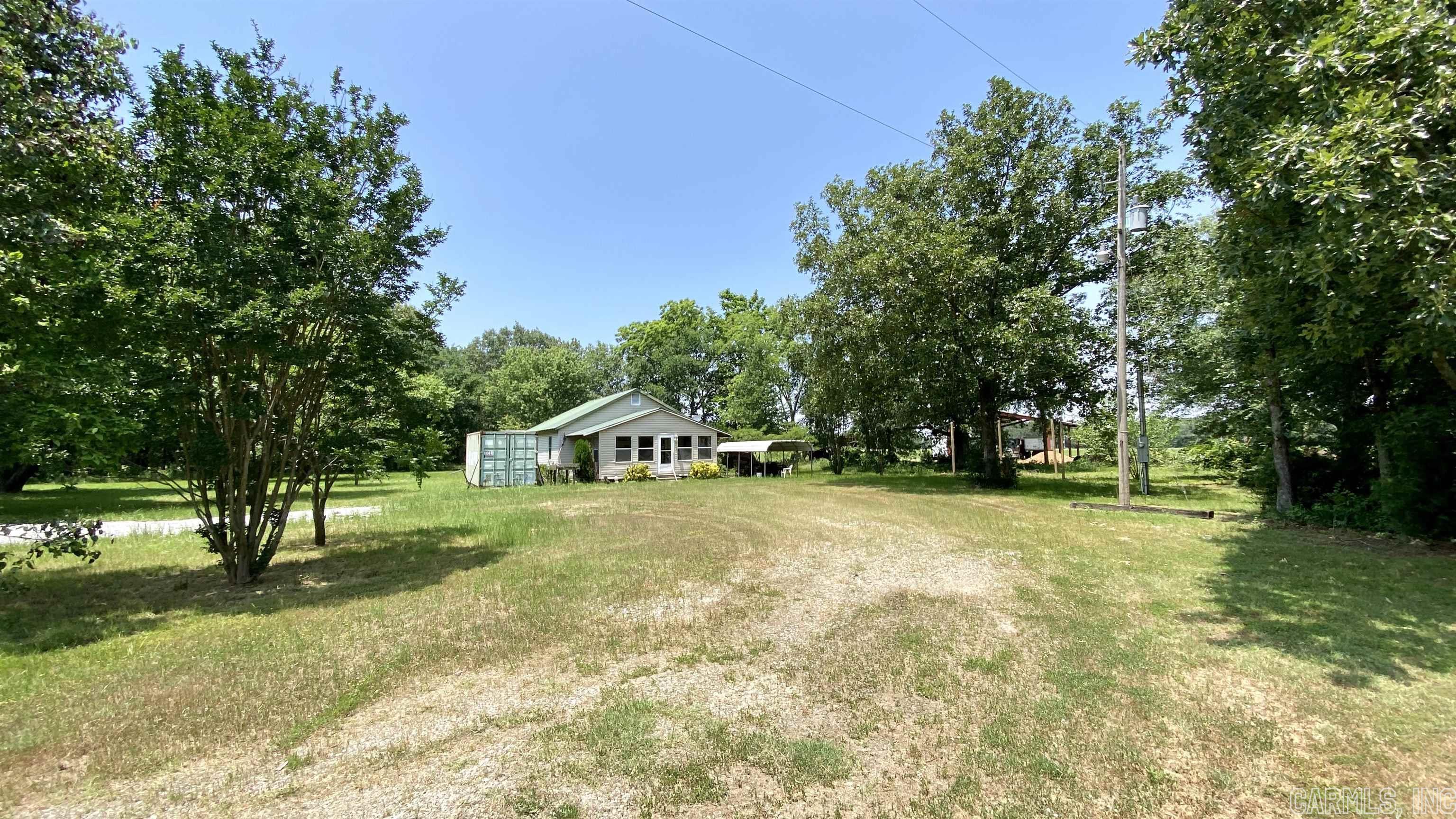 The Hunter House is situated inside the city limits of Hunter, AR nearby tons of public ground. It's a 3 bedroom, 2 bath home with an enclosed front porch and a 20ft container outside to keep more gear secured. The property is at the end of a dead end road on the north end of town giving you great privacy. The circle drive and large yard offer plenty of space to park trucks, trailers and boats. It's selling like it sits, furniture included, making things very easy for you and your group to step into.