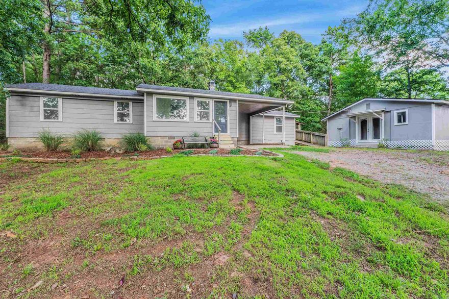 Welcome to this charming, updated home nestled on approximately 1.49 acres in the Marche community. Originally built in 1950 and extensively remodeled in 2025-2026, this property offers a blend of character and modern updates. Recent improvements include fresh interior paint, new carpet, luxury vinyl plank flooring, updated bathrooms, new windows, new roof, new septic system, and updated plumbing with copper lines replaced by PEX. The water service line from the meter to the home has also been replaced with PEX. The main home features three mini-split HVAC units, neutral colors throughout, and a welcoming mudroom/sunroom that offers flexible space for hobbies, plants, storage, or everyday use. The kitchen refrigerator, washer, and dryer convey in home and detached cottage.  A detached cottage provides additional living space and includes a kitchenette with refrigerator, stove, and sink, plus a bedroom, bathroom, washer, dryer, and its own mini-split HVAC unit.   Set back from Marche Rd, the property offers a peaceful, private setting with an expansive yard and plenty of outdoor space to enjoy.  Agents see remarks .