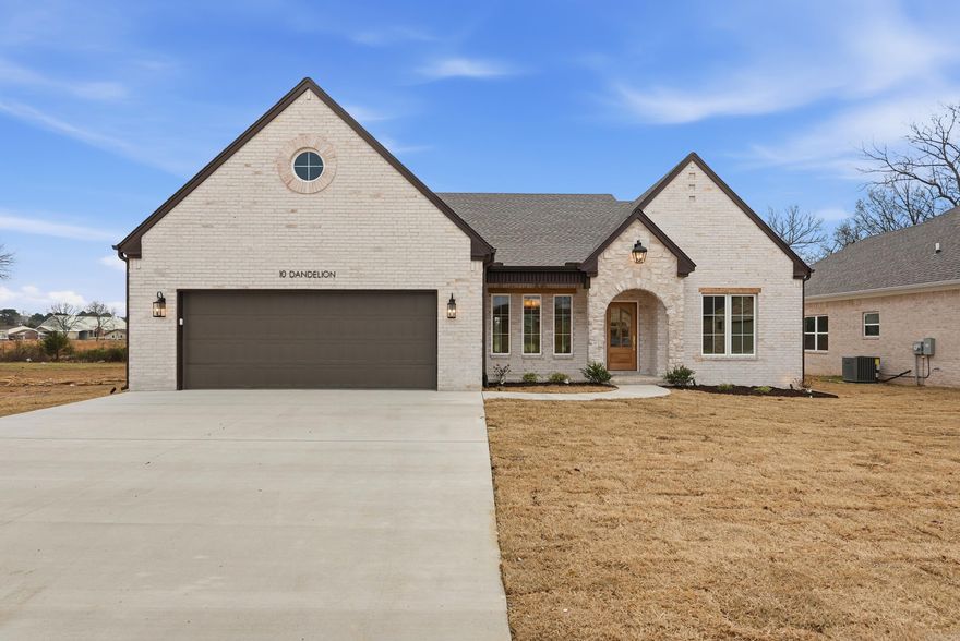 This stunning transitional cottage by Sage & Stone Homes combines timeless design with modern functionality, featuring 9’ ceilings with a vaulted living room accented by a cozy gas fireplace and beams, quartz countertops throughout, and durable LVP and tile flooring. The gourmet kitchen shines with stainless steel appliances, a gas range, and a spacious walk-in pantry, while the primary suite boasts a curbless entry walk-in shower, soaker tub, and the convenience of a laundry room that connects directly to the primary closet. Additional highlights include a large covered back patio perfect for entertaining, a dedicated laundry room with a connecting mud-room area, a separate dining space, and energy-efficient touches such as a tankless gas water heater. Agent see remarks.