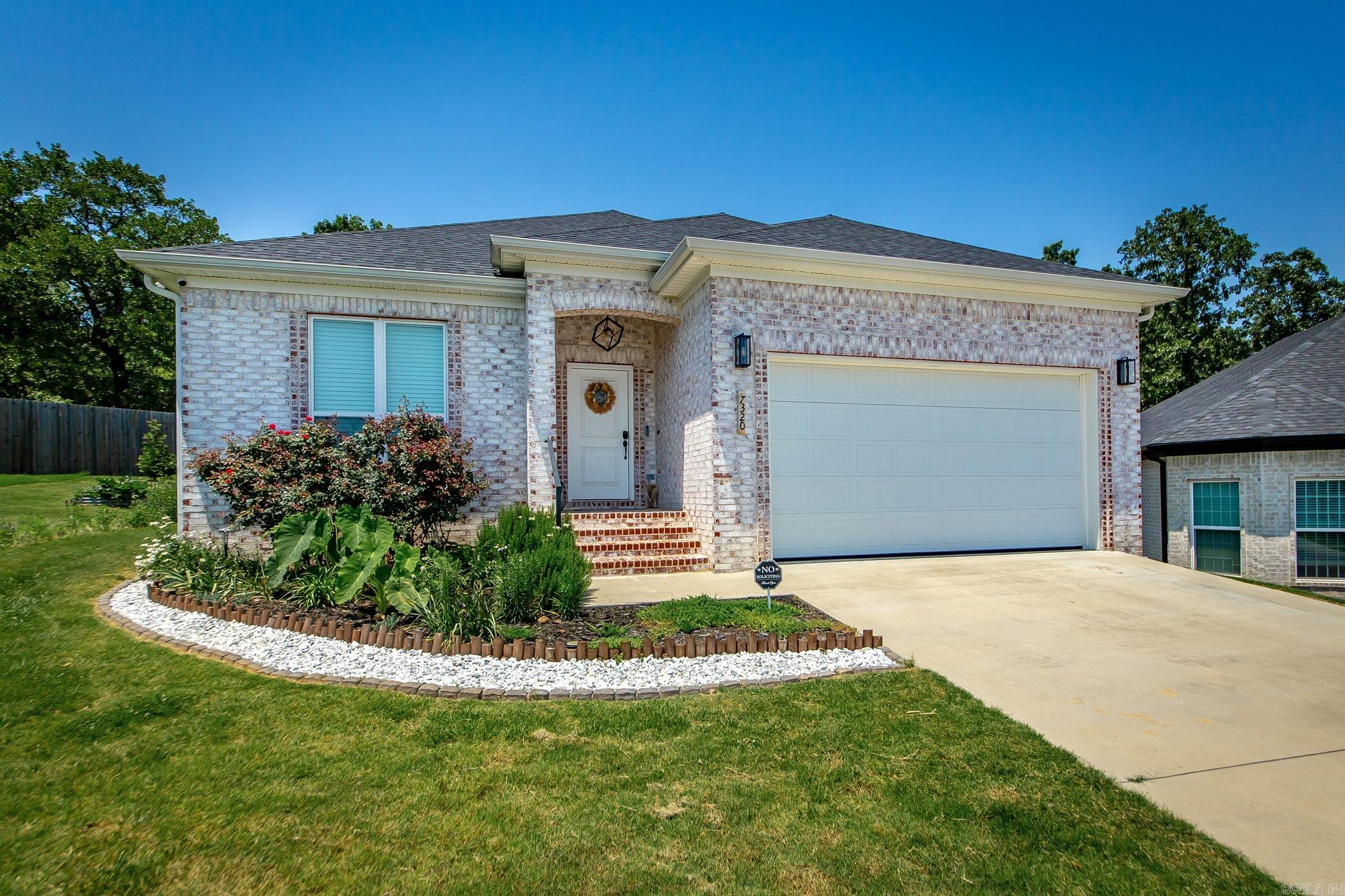 Charming All-Brick Home in Wandering Ridge Subdivision Tucked away in a peaceful cul-de-sac within the desirable Wandering Ridge Subdivision, this beautifully maintained 3-bedroom, 2-bath home offers 1,947 square feet of inviting living space. Step inside to a spacious living area featuring elegant tray ceilings, crown molding, and a cozy fireplace. Large windows trimmed to perfection fill the space with natural light, flowing seamlessly into the modern kitchen complete with granite countertops, stainless steel appliances, and a breakfast barāideal for casual dining or entertaining guests. The split floor plan ensures privacy, with the primary suite thoughtfully set apart. The master retreat includes a generous walk-in closet, double vanities, a walk-in shower, and a large soaking tub for relaxing at the end of the day. Additional highlights include a well-appointed laundry room, ample storage, and 9āā10ā ceilings throughout. Out back, enjoy your morning coffee or evening unwind on the covered patio, overlooking a spacious backyard that backs up to a serene wooded areaāproviding both beauty and privacy. Donāt miss this opportunity to own a quiet, stylish retreat.