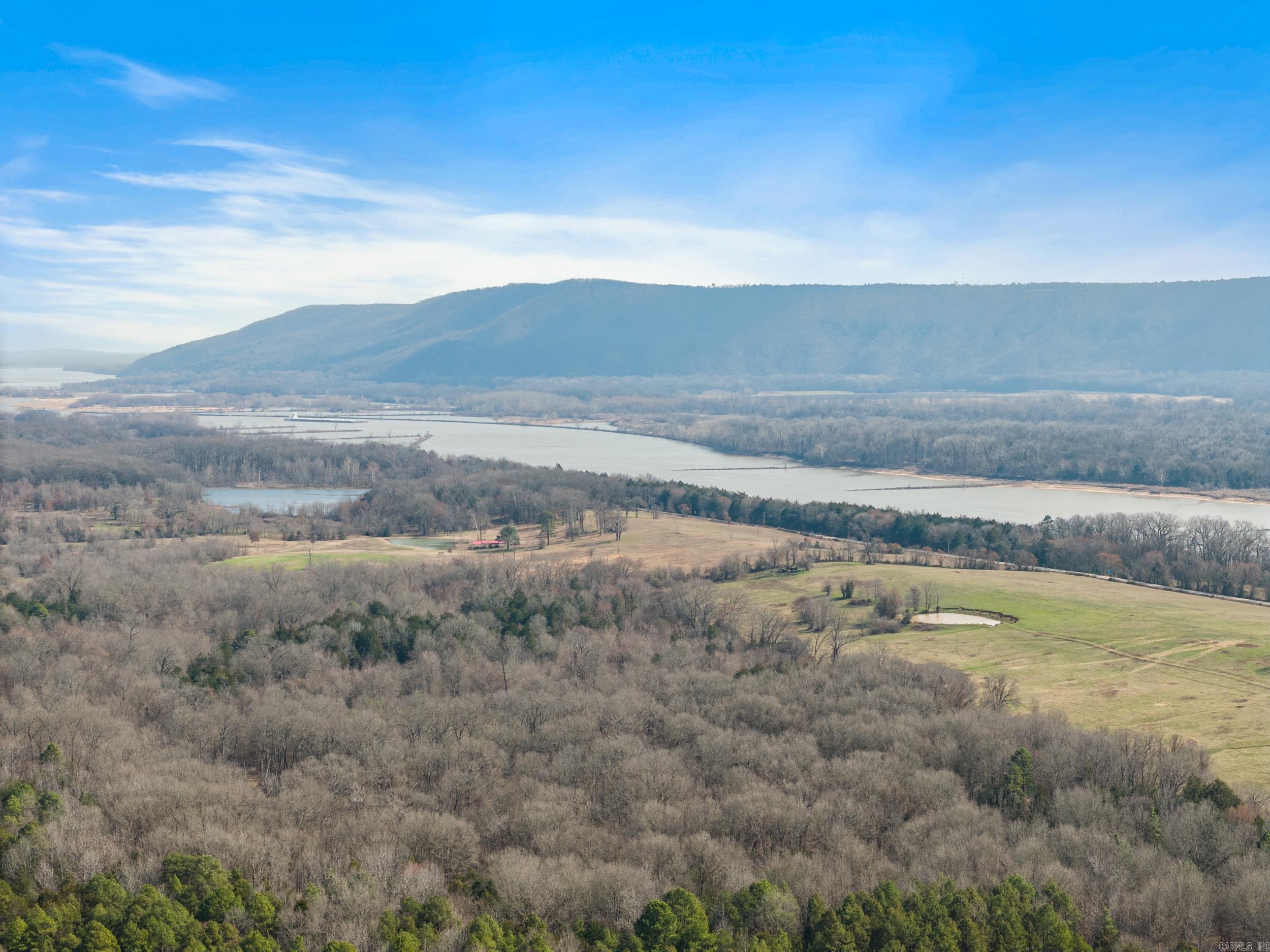 80 Acres of Prime Recreational Land Bordering Galla Creek WMA!! Discover your very own piece of outdoor paradise with this exceptional 80-acre +/- recreational property, perfectly positioned for those who love the great outdoors. Bordering Galla Creek Wildlife Management Area on both the north and west sides, this land offers direct access to public hunting and outdoor activities. Whether you enjoy hunting or simply escaping to nature, this property is an incredible opportunity to own a secluded retreat. The land features a mix of mature trees, cedar thickets and established food plots, creating an ideal environment for deer, turkey, waterfowl and other wildlife. This property offers a peaceful, secluded retreat while still easily accessible, thanks to a legal easement that ensures convenient entry. The Arkansas River is just across the highway and Sweeden Island Park & Lake Atkins are also nearby for additional outdoor activities. As you approach the property, you'll take in views of Petit Jean Mountain and the Arkansas River, adding to the beauty and appeal of this location. This is a rare chance to own a private, peaceful escape in the Galla Creek area!! Act quick & call today!