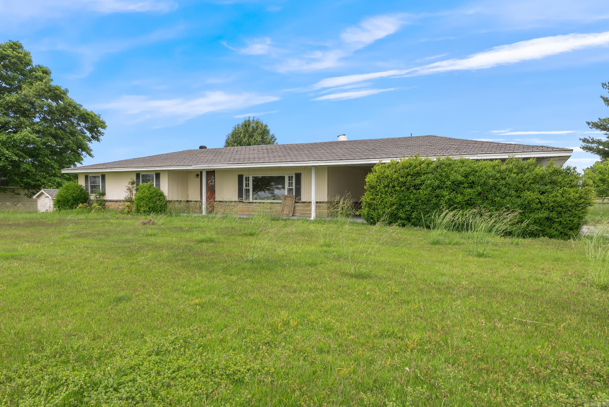 Welcome to your slice of rural paradise! This beautiful 93-acre farm offers a rare combination of functionality, natural beauty, and comfortāperfectly suited for livestock, hay production, or your dream homestead. The land is a mix of multiple fenced pasture areas with breathtaking views all the way to Mount Nebo, providing both productivity and picturesque scenery. Youāll find four ponds scattered across the property, ideal for livestock watering or potential fishing spots. Farm infrastructure includes a massive hay/feed barn, a tack barn, a corral pen, and ample Shop/Shed for farm equipmentāeverything you need to run a smooth, working farm. A detached garage with electricity is also perfect for additional workspace or tool storage. The charming 3-bedroom, 1-bath farmhouse offers comfort and warmth, with an updated kitchen and bathroom and incredible views right from your windows. Enjoy peaceful evenings or cultivate your crops in the garden space out back. Whether you're starting a ranching operation or looking for a peaceful retreat with room to grow, this property is a must-see. Don't miss out on the amazing build sites on the top pasture.