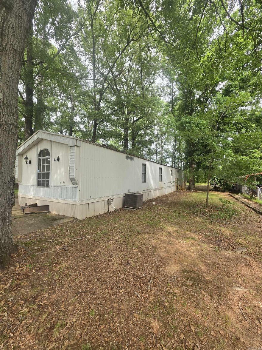 Owner financing available!  This fully remodeled mobile home features 3 bedrooms and 2 bathrooms, offering a spacious and modern living space. The open-concept layout includes updated flooring, fresh paint, and upgraded finishes throughout. The kitchen has been renovated with contemporary cabinetry, countertops, and some appliances for both functionality and style. Situated on a 0.27-acre lot, the property provides plenty of outdoor space for entertaining, or personal additions like a garden or play area. Conveniently located near shopping areas and schools.
