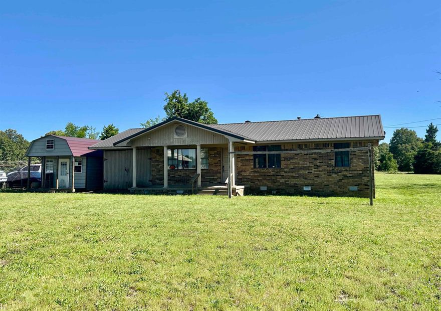 Highland AR home on 1.25 acres with Highway frontage.  This brick home has been residential and commercial.  Located on prime land in Highland and centrally located between Hardy and Ash Flat, AR. City water, sewer, and high-speed internet are in place.  There is a 6x10 Bald Eagle Storage Building and a 1-car garage.  Land lies flat.  There is additional acreage available.