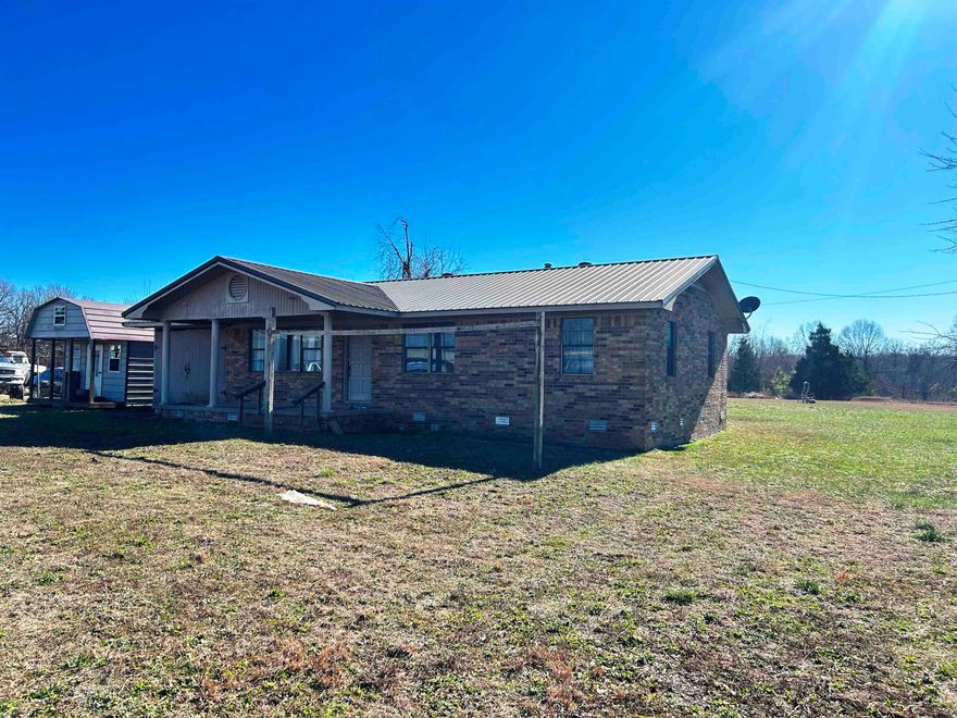Highland AR home on 1.25 acres with Highway frontage.  This brick home has been residential and commercial.  Located on prime land in Highland and centrally located between Hardy and Ash Flat, AR. City water, sewer, and high-speed internet are in place.  There is a 6x10 Bald Eagle Storage Building and a 1-car garage.  Land lies flat.  There is additional acreage available.