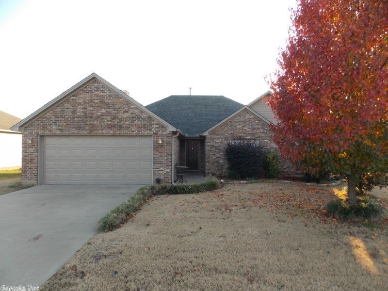 Do you want bang for your buck? This home will give you that! You will love the brand new hand-scraped hardwoods throughout, two covered patios, huge master bedroom with sitting area, double vanities in the master bath, large walk in closet, separate shower, jetted tub, separate dining room (or office), split bedroom plan, well manicured lot, and last but certainly not least, LAKE FRONT! This home has been extremely well taken care of. Its condition is a 10 out of 10. Make your appointment today!