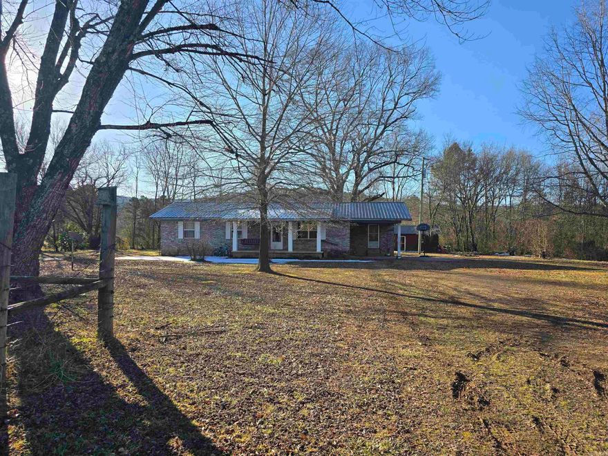 Escape the hustle and bustle with this charming 3-bedroom, 1-bathroom home nestled in a serene country setting. Located approximately 16 miles from Harps Food Stores in Waldron, this property offers the perfect balance of rural privacy and accessible convenience. Inside, you’ll find a functional layout featuring a dedicated laundry room and fresh, new carpet in several areas of the home, providing a clean and cozy feel. Outside, the property is designed for utility and relaxation:  convenient attached carport to keep your vehicle out of the elements; Two spacious outbuildings in the back, ideal for tools, hobbies, or seasonal gear; One storage building is equipped with electrical power, making it a perfect spot for a workshop or "man cave/she-shed." Whether you’re looking to enjoy your morning coffee in total silence or need a bit of extra space for your projects, this property delivers. Enjoy the stars at night and the peace of the Arkansas countryside during the day.