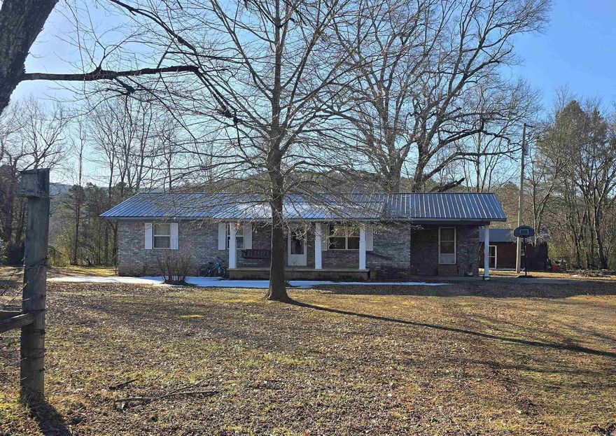 Escape the hustle and bustle with this charming 3-bedroom, 1-bathroom home nestled in a serene country setting. Located approximately 16 miles from Harps Food Stores in Waldron, this property offers the perfect balance of rural privacy and accessible convenience. Inside, you’ll find a functional layout featuring a dedicated laundry room and fresh, new carpet in several areas of the home, providing a clean and cozy feel. Outside, the property is designed for utility and relaxation:  convenient attached carport to keep your vehicle out of the elements; Two spacious outbuildings in the back, ideal for tools, hobbies, or seasonal gear; One storage building is equipped with electrical power, making it a perfect spot for a workshop or "man cave/she-shed." Whether you’re looking to enjoy your morning coffee in total silence or need a bit of extra space for your projects, this property delivers. Enjoy the stars at night and the peace of the Arkansas countryside during the day.