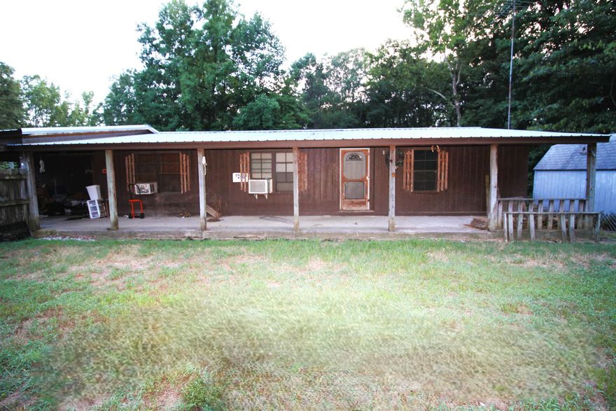 This one of a kind property on a permanent foundation has beautifully handcrafted hardwood flooring, oak cabinetry, a large living space with pellet stove, 3 bedrooms, 2 full baths and 5 acres of land in beautiful Glenwood Arkansas.  Starting your life in your own home is not out of reach and with the multiple storage buildings, you have room to grow.  The log home on the property will be removed by the seller to create even more space for you to enjoy! Call today!