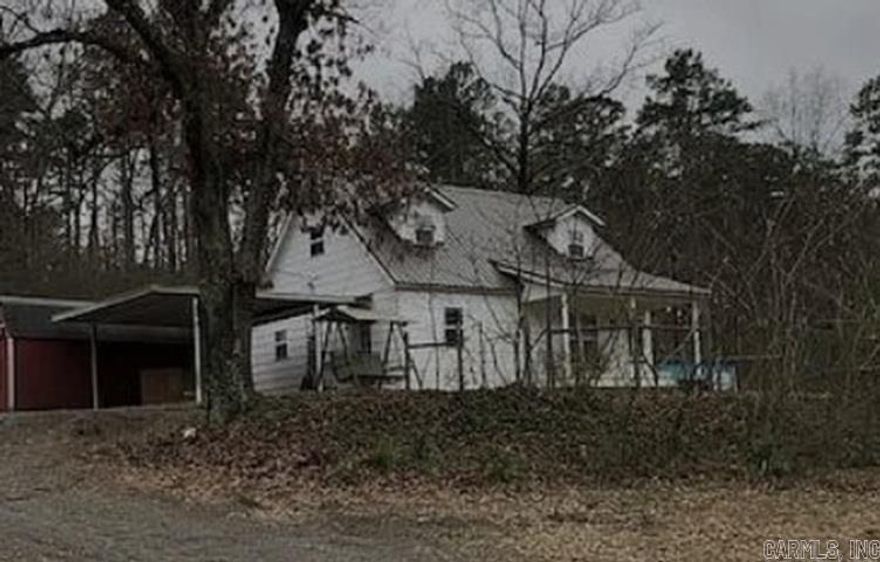 This home is a great fixer-upper in a desirable area. It wouldn't take much to restore this to the "doll house" it once was. Original Hardwoods under the carpet