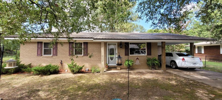 Welcome to the charming home at 211 Raymond Circle Drive in McCrory. This three bedroom, one bath, all electric brick home has some recent updates including a kitchen remodel with new cabinetry, stainless steel appliances and granite countertops. Three wood wrapped columns and pretty flower beds provide great curb appeal and the chain link fenced yard just needs a gate added to completely enclose the property. Additional features include a new water heater, a heat pump added approximately 2 years ago, and a metal roof that's less than 3 years old. Possibly the BEST part... this home comes FULLY FURNISHED at list price! Living room furniture, bedroom suites, dining room table, kitchen appliances (refrigerator, stove, dishwasher and microwave), and washer & dryer are ALL INCLUDED! The seller will be taking wall and room decor and personal items. Are you ready to MOVE RIGHT IN? Call 501-454-9943 for an appointment! NOTE: The measurements listed on the floor plan rendering included among the property photos are approximate and are provided solely as a tool to help the buyer visualize the layout of the home. AGENTS SEE REMARKS