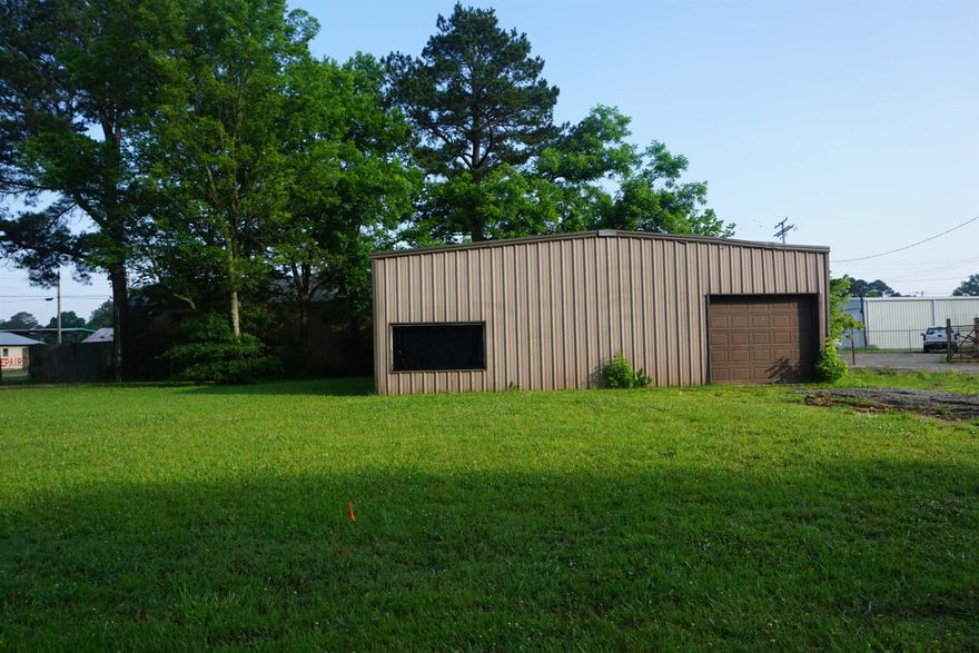 Huge metal shop building that is wired and has plumbing to it. The electric meter pole was removed so no electricity currently on. There is an automatic door in the front and a manual door on the side. Tons of possibilities and is only a  couple of minutes from Searcy and the interstate. See agent remarks for showing instructions