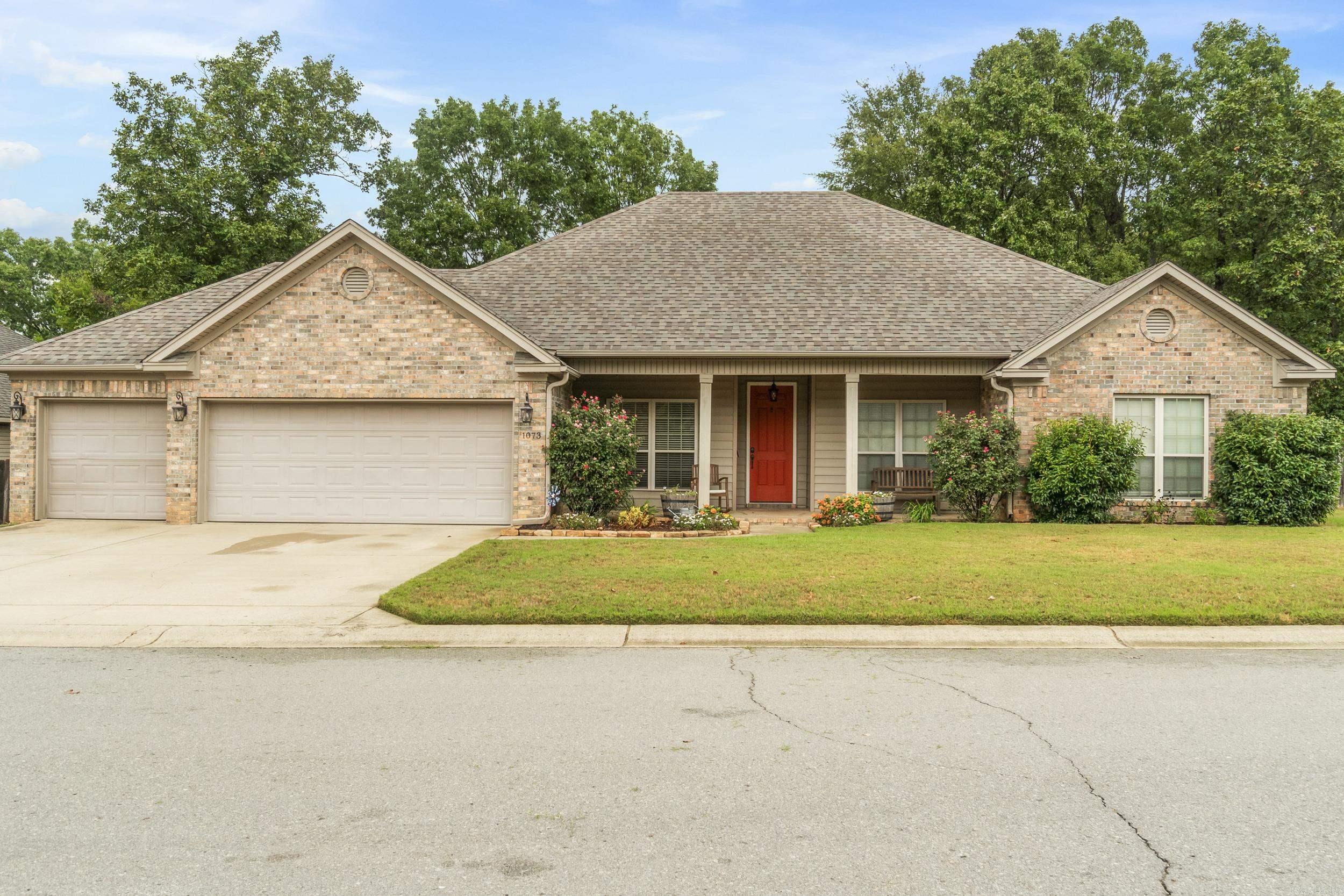 Welcome home to this beautiful 4-bedroom, 2-bath property in the highly sought-after Bryant School District! Tucked away at the end of a quiet cul-de-sac on Emerald Mountain, this home offers both privacy and charm with a fenced backyard featuring a fire pit and tranquil water feature. Step inside to enjoy an open, split floor plan with high ceilings, two spacious living areas, and a formal dining room perfect for entertaining. The kitchen boasts custom stained maple cabinetry, stainless steel appliances, a breakfast bar, and even a built-in desk nook. The primary suite is large with a spacious en-suite bath and large closet, while the additional bedrooms are generously sized with plenty of storage. Outside, relax on the covered back porch or take advantage of the 3-car garage for extra space. Bonus: With a reasonable offer, the sellers are including a $5,000 paint and flooring allowance so you can add your own personal touch and make this home truly yours!