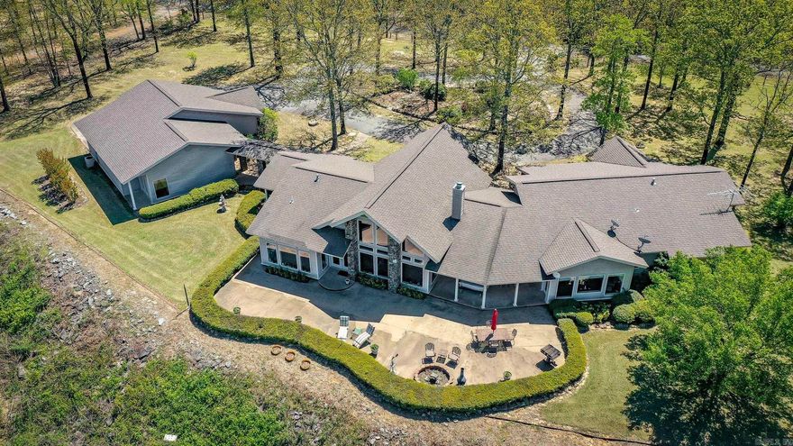 First time ever this one-of-a-kind property has been offered to the market!! Custom built and meticulously thought-out house plans and placement on the bluff with panoramic views from every room is an absolute dream and now can become your reality. Views of the Narrows bridge going into Greers Ferry and beyond as far as the eye can see. Gated entrance to Cliffview Tracts Subdivision provides extra peace of mind. Home has a Generac generator backup for essential things in the home and garage doors. ALL ONE LEVEL with easy maintenance large concrete patio, no deck. Every part of the house is under a covering with a breezeway connecting the full guest apartment and garage. Total under roof sq footage to include the garage is over 5900. Main house has 4 bedrooms and 2.5 baths. Apartment has full bath living area with kitchen and bedroom area. Washer hook up is in garage if you needed a second laundry. The home has city water but also has an over 400 foot deep well for watering plants or to have for your garden. This type of home does not come around often and has to be seen in person to really appreciate its beauty. Agents, please see ALL remarks and must call list agent for address.